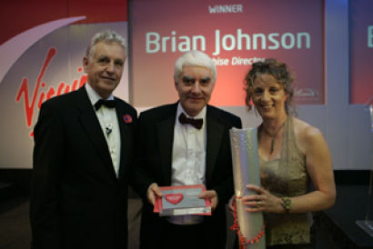 With thanks: Brian receives his award from Nicholas Owen and Eileen Guttmann.