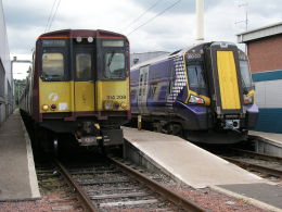 Image of Class 314 and Class 380 units at Corkerhill depot